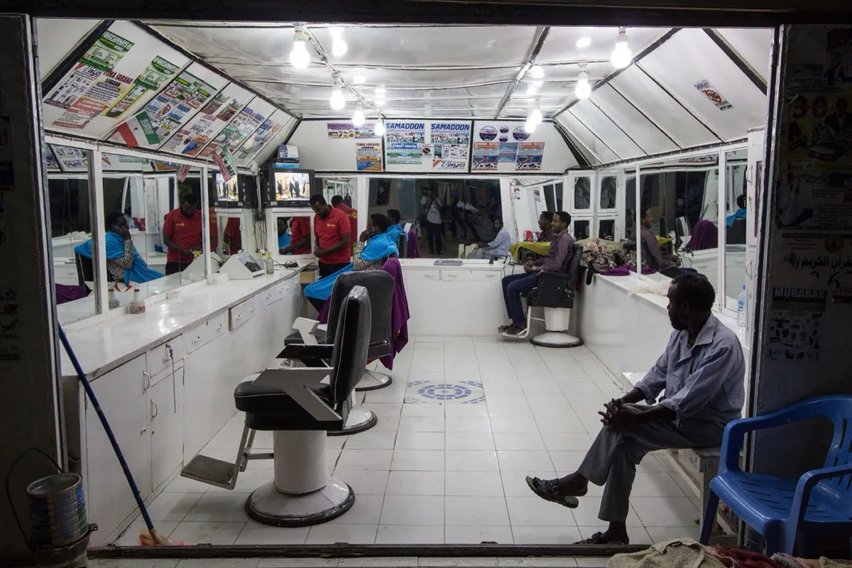 Division Multiplied, photo 08. A barbershop in Burao.