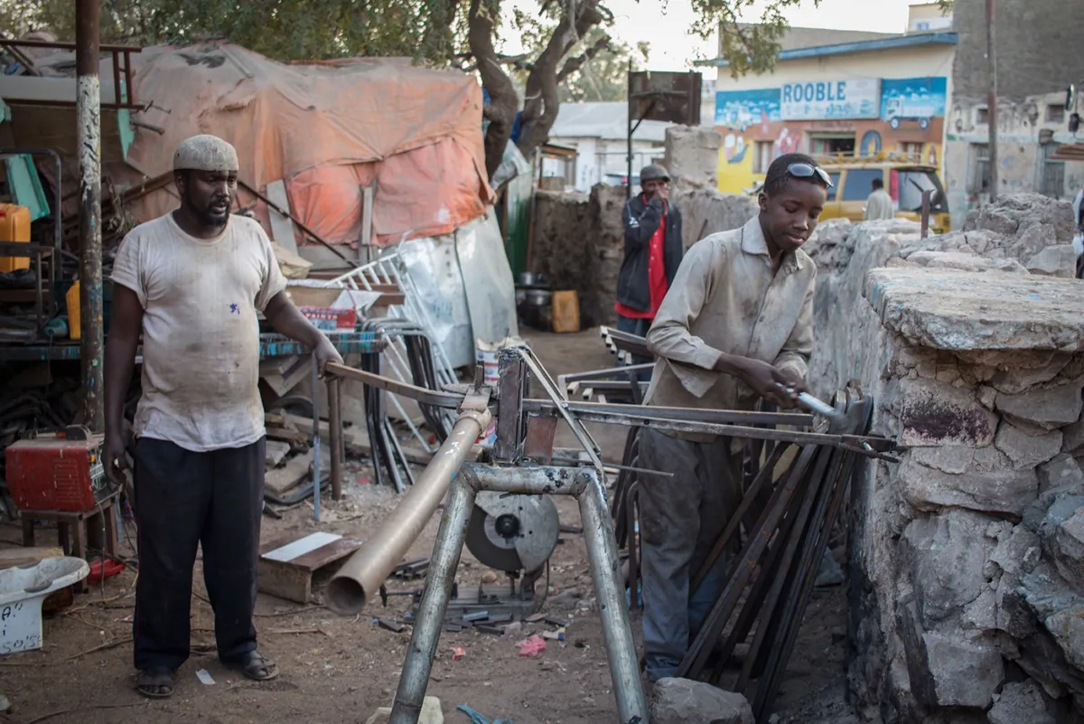 Division Multiplied, photo 11. Blacksmithing is a common trade among the Gabooye clans.